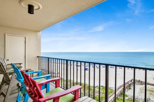 a balcony with two chairs and the ocean at Phoenix II 2062 in Romar Beach