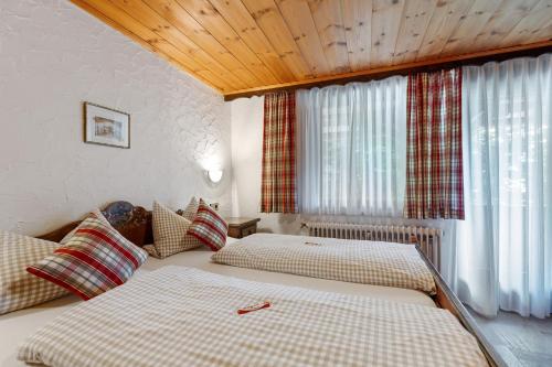 Postel nebo postele na pokoji v ubytování Gästehaus Löwen