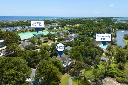 an aerial view of a town with trees and houses at Animal House in Corolla