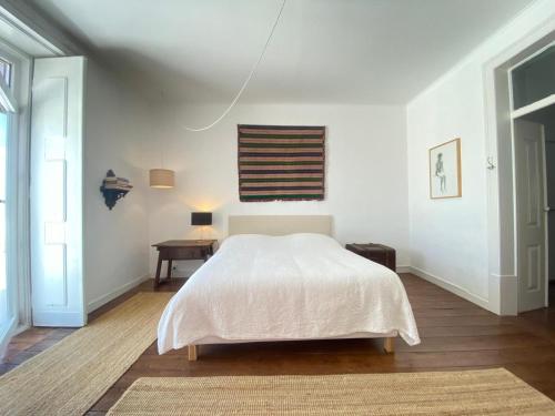 En eller flere senge i et værelse på Casa antigo Ferro Crucieira