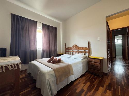 Ένα ή περισσότερα κρεβάτια σε δωμάτιο στο Apartamento Central em Araxá
