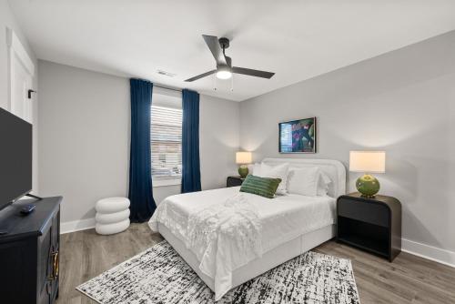 a white bedroom with a bed and a ceiling fan at Rivers Edge - 111 Hickory Grove BLVD in Clarksville