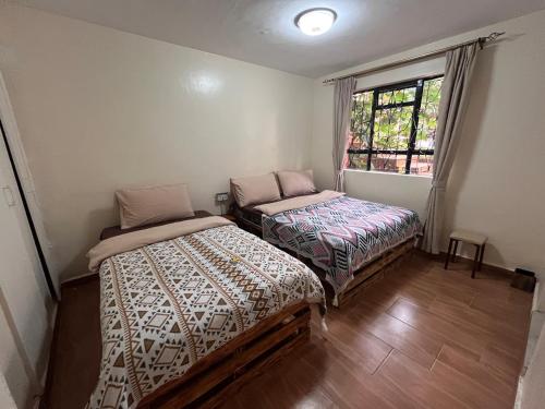 Ein Bett oder Betten in einem Zimmer der Unterkunft ZZZ hostel Nairobi