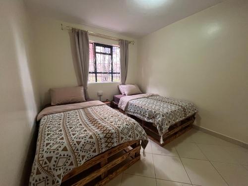 Ein Bett oder Betten in einem Zimmer der Unterkunft ZZZ hostel Nairobi