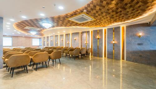 a large room with a bunch of chairs in it at Hotel Kanha & Banquet in Mohāna