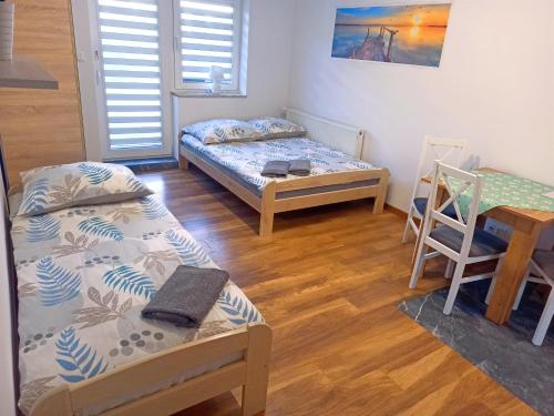 Postel nebo postele na pokoji v ubytování Dobra Nocka