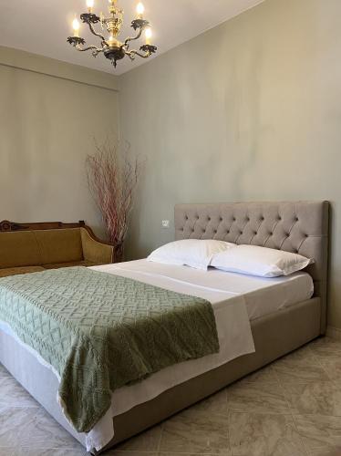 Ένα ή περισσότερα κρεβάτια σε δωμάτιο στο Elly Apartment