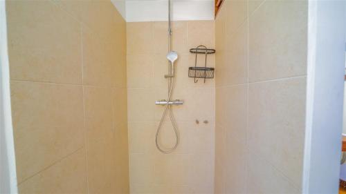 a shower with a shower head in a bathroom at St Jean Hilltop Three-Bedroom Villa with Pool in Gustavia
