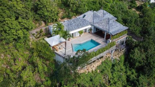 an overhead view of a house with a swimming pool at St Jean Hilltop Three-Bedroom Villa with Pool in Gustavia