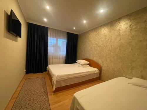 Postel nebo postele na pokoji v ubytování Vila Costin - camere de închiriat