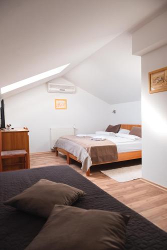 Postel nebo postele na pokoji v ubytování Garni Hotel Keltika