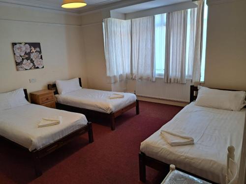 Ένα ή περισσότερα κρεβάτια σε δωμάτιο στο Abbeyfield Guesthouse