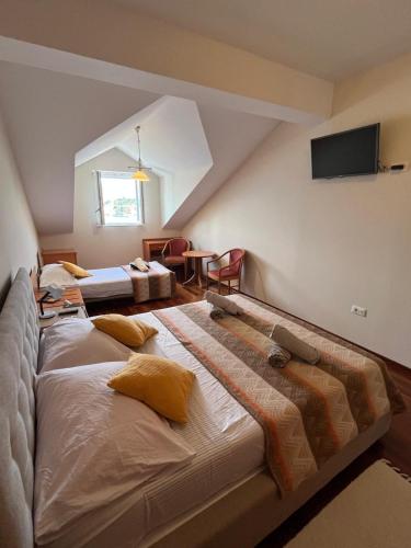 Katil atau katil-katil dalam bilik di Boutique Hotel Tomić