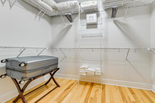 a laboratory with a briefcase on a stand in a room at Home 2 Mi to Beach and Old Town Bay St Louis! in Bay Saint Louis