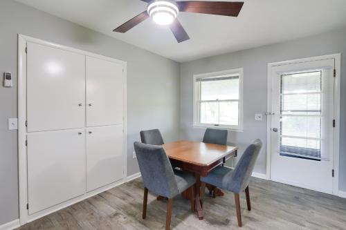 a dining room with a wooden table and chairs at 5 Mi to Zoo Family Retreat in Wichita! in Wichita