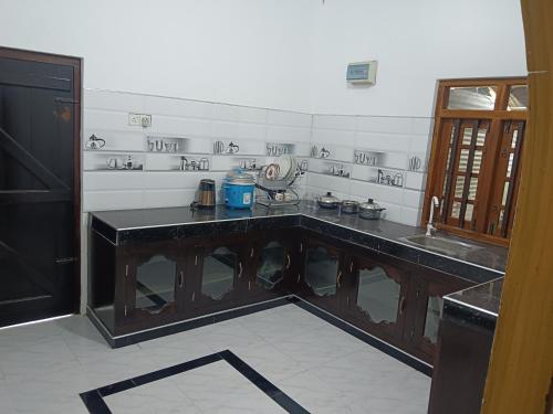Kuchyň nebo kuchyňský kout v ubytování Suman Beach Rooms