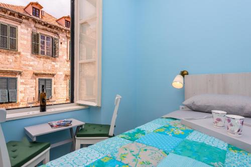 Postel nebo postele na pokoji v ubytování Stradun View En Suite Rooms & Studio