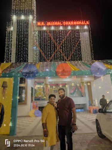 two men are standing in front of a store at Jaiswal Dharmshala in Sultānpur