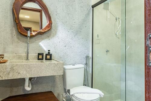 Koupelna v ubytování Apt com piscina e churrasqueira VNR005