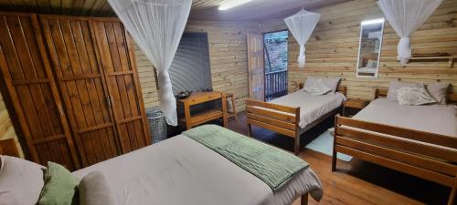 Un pat sau paturi într-o cameră la Kuusamo Holiday Resort