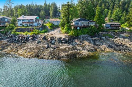 an aerial view of a house on the shore of a body of water at 6 Mi to Main St Oceanfront Cottage in Ketchikan in Ketchikan