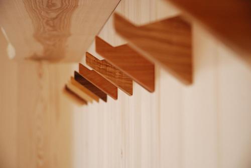 four pieces of wood hanging on a wall at Landgasthof Pink in Sankt Jakob im Walde
