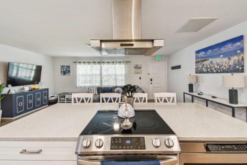 a kitchen with a stove top oven in a room at The Palm Oasis at Clearwater in Clearwater