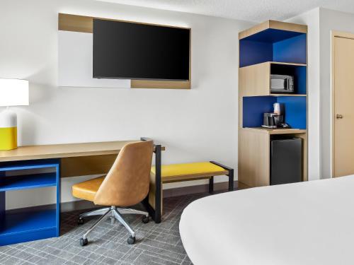 a room with a desk and a tv at Comfort Inn & Suites O'Fallon - St Louis Area in O'Fallon