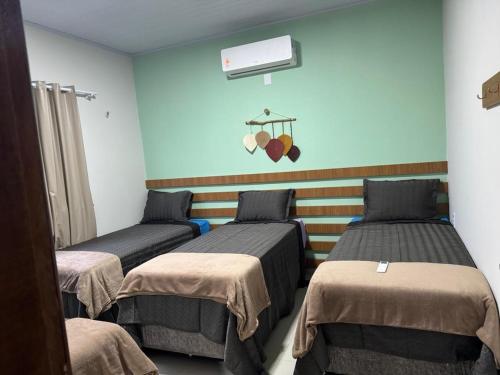 Postel nebo postele na pokoji v ubytování Aconchego das Dunas