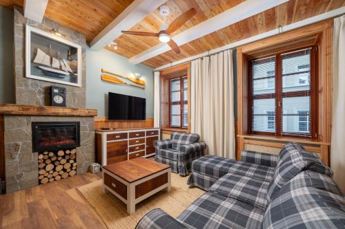 a living room with a couch and a fireplace at Old House Apartments 2 Poznań in Poznań