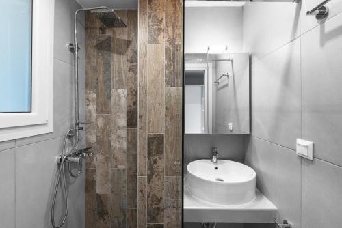 a white bathroom with a sink and a shower at "HoMes" II, The aRt BoutiQue experience by Lou Lenny in Kallithea Halkidikis