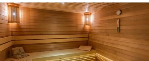 a small wooden sauna with a bench in it at ToTi Kalman in Zlatibor