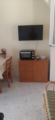 TV a/nebo společenská místnost v ubytování Casa Lorella