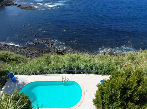 an overhead view of a swimming pool next to the ocean at Eirinhas Bela Vista RAAL 2909 in Maia