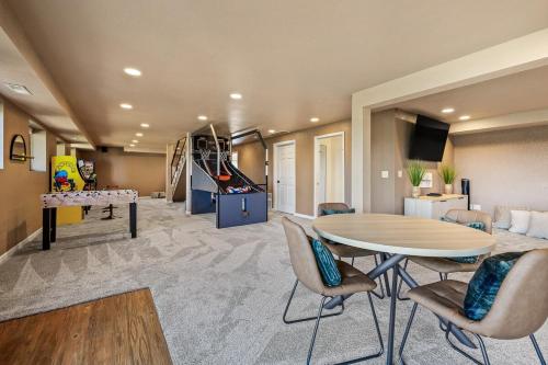 a living room with a ping pong table and a game room at Panorama Peak Mountain Hideaway in Custer