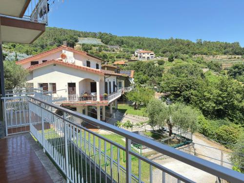 a view of a house from a balcony at Garden & Seaview - Relax for Bikers and Families in Bardino Vecchio