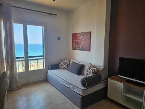 Televízia a/alebo spoločenská miestnosť v ubytovaní Corfu Dream Holidays Villas