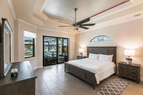 a bedroom with a bed and a ceiling fan at Neptunes Realm in Marco Island