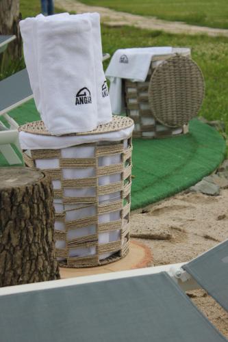 a stack of towels sitting on top of a table at Domes Town by ANGAR in Vahagnadzor