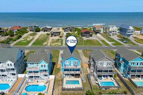 an aerial view of a homes with a hot air balloon at Carolinian in Nags Head