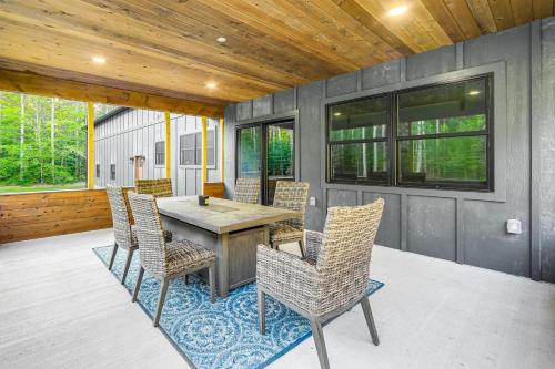 a patio with a wooden table and chairs at Brantingham Home ATV and Snowmobile Trails On-Site! in Glenfield