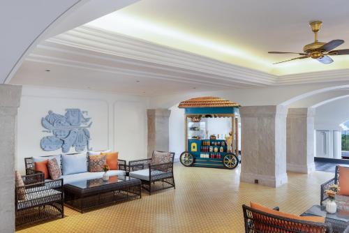 a living room with a couch and a table at Gateway Varkala in Varkala