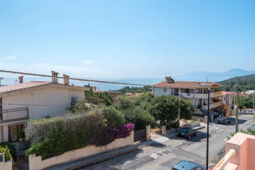 an aerial view of a city with houses and a street at Calagonone Seaview House in Cala Gonone