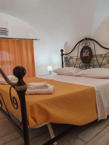 Ένα ή περισσότερα κρεβάτια σε δωμάτιο στο Vaccarini Home