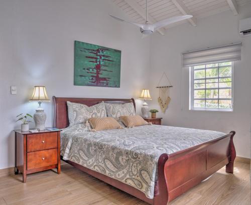a bedroom with a large bed with two night stands and two lamps at 2 Bedroom Dream Cottage-Point Blanche in Philipsburg