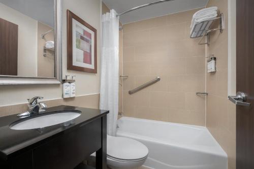 a bathroom with a sink and a toilet and a shower at Holiday Inn Express Manhattan Midtown West by IHG in New York
