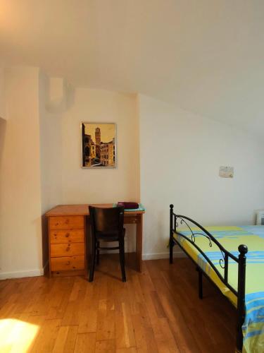 a bedroom with a bed and a desk and a chair at Jolie chambre Privée Centre-Ville in Nice