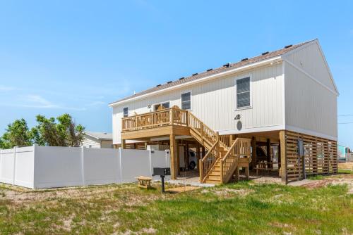 a house with a porch and a deck at Coles Cabana in Kill Devil Hills