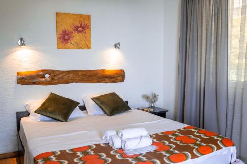 a hotel room with a bed with towels on it at Livada in Gonio