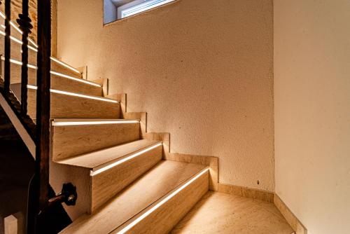 a set of stairs in a building with a window at ŽIŽULA Rooms in Vela Luka